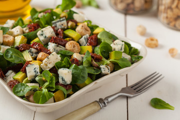 Italian salad with avocado, gorgonzola cheese.