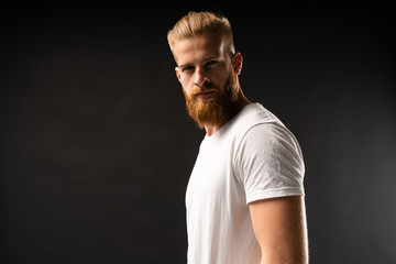 Handsome young guy posing in studio - isolated.