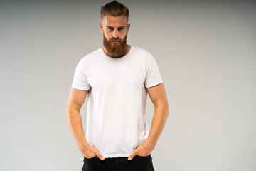 Handsome young guy posing in studio - isolated.