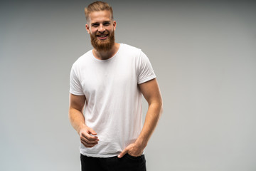 Handsome young guy posing in studio - isolated.