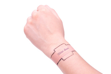 Downshifting concept: A drawing watch on wrist called Slow down.