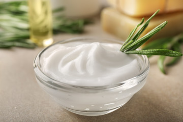 Bowl with natural body cream on table, closeup
