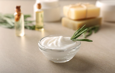 Bowl with natural body cream on table