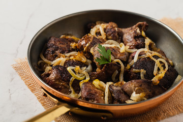 Fried chicken liver with onions.