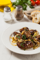 Fried chicken liver with onions.