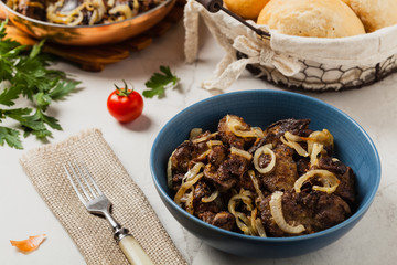 Fried chicken liver with onions.