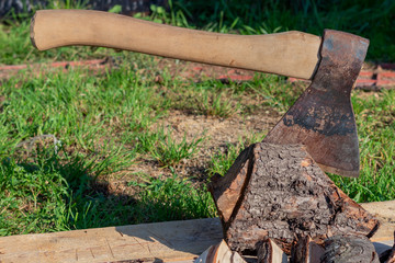 the ax is stuck in a log