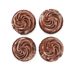 Tasty chocolate cupcakes on white background, top view
