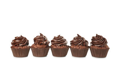 Tasty chocolate cupcakes on white background