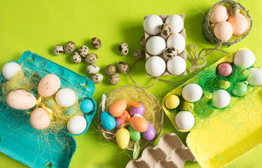White chicken Chicken and quail eggs in colored paper eco-friendly packaging with  sisal Close-up photo Easter background 