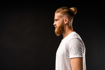 Side view portrait of thinking stylish young man looking away.