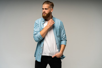 Portrait of happy fashionable handsome man in jeans shirt look at camera.
