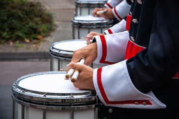 Details from a show and Marchingband or fanfare and drumband with uniforms and Instruments.