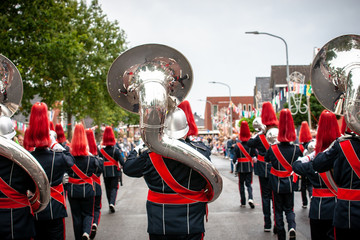 Details from a show and Marchingband or fanfare and drumband with uniforms and Instruments.