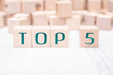 The Words Top 5 Formed By Wooden Blocks On A White Table