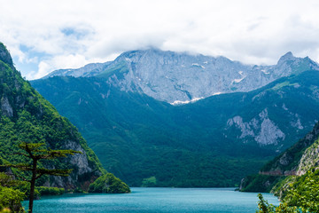 beautiful Piva Lake, mountains and clouds in Montenegro
