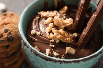 Cup of hot chocolate with walnut, closeup