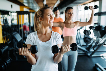 Fototapeta na wymiar Women working out in gym