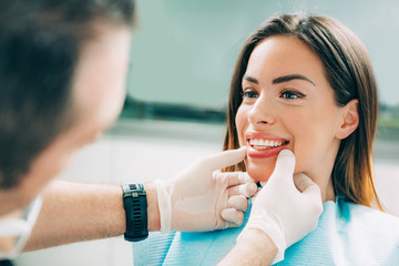 Dentist with beautiful female patient