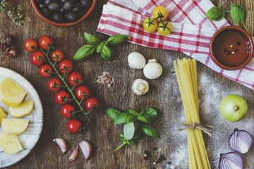Stylish composition of fresh, italian ingredients and food on the vintage wooden table. Culinary backgrounds. Top view.