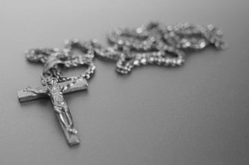 crucifixion from a tree Jesus's gilt figure black and white image with copyspace for text