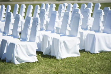 wedding ceremony chairs with white covers