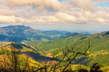 Obraz premium Beautiful landscape view of hill and mountain with cloud sky.