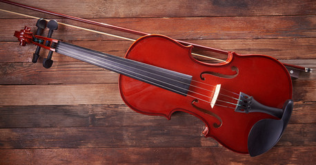violin and bow on an old wooden background