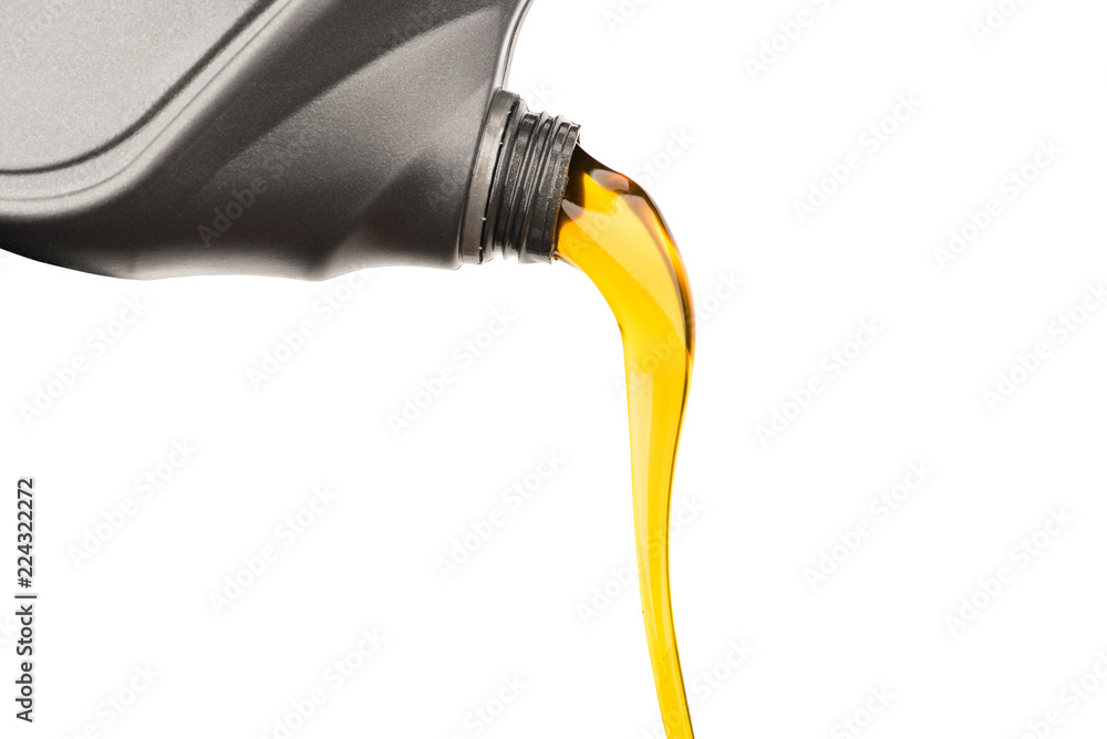 Wall mural Pouring oil lubricant motor car from gray bottle on isolated white background