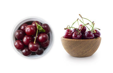 Fresh red cherries lay on white isolated background with copy space. Cherries in a bowl. Background of cherries. Ripe cherry on a white background. Cherry fruit.