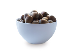 Fresh hazelnuts isolated on white background. Hazelnuts in a bowl with copy space for text. Hazelnut close-up.
