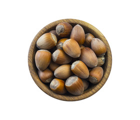 Fresh hazelnuts isolated on white background. Hazelnuts in a bowl with copy space for text. Hazelnut close-up. Top view.