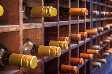 Collection of bottles of wine on wooden cases