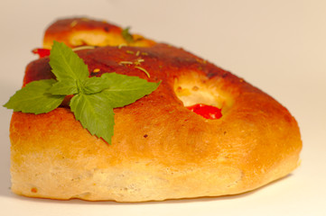 Italian focaccia bread with tomatoes and herbs