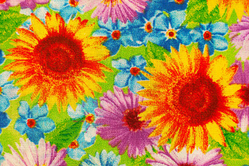 Fototapeta na wymiar Texture of bright cotton fabric. Colorful cotton fabric for sewing. Texture of fabric creates a background. Summer sunflowers on fabric.