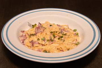 Pasta with white sauce and bacon