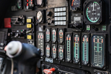 Helicopter cockpit. Details of dashboard, control panel, indicators and fire buttons. War machine, air bomber. 
