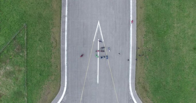 Top down view of police plane fly over a group of bikers