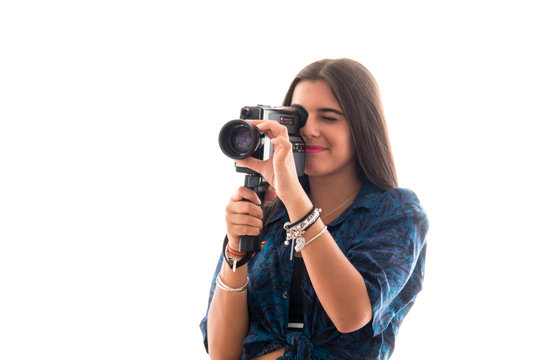 young girl posing with an old camera super 8 on white background
