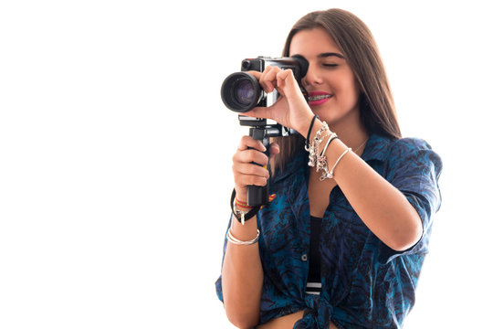 young girl posing with an old camera super 8 on white background