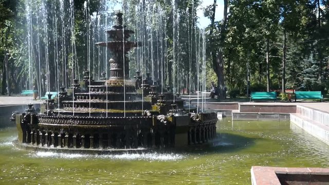 Beautiful fountain in city park, Baroque architecture. Steadicam shoot.