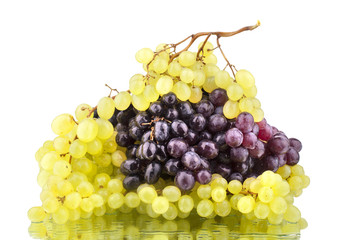 Black and white grapes on a white mirror background isolated close up
