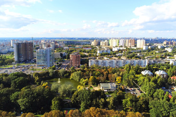 Fototapeta premium Aerial view of Kiev park and old famous exhibition complex VDNH. Metropolis Ukraine capital panoramic scenic autumn drone photo