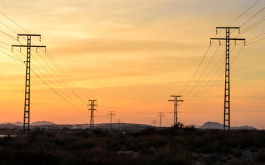 High voltage power lines at sunset