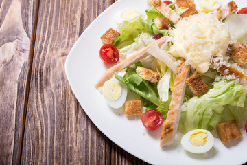 Salad ceasar with chicken , eggs and tomatoes