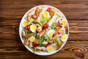 Salad ceasar with chicken , eggs and tomatoes