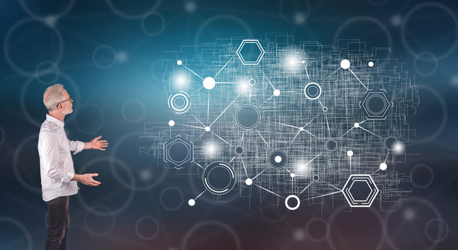 A virtual network explained by a businessman on a wall screen