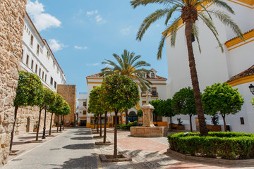 Fototapeta na wymiar Marbella, Spain - May 4, 2018: Old historic center with small streets of the Spanish city. Andalusia. Costa del Sol.