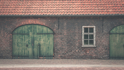 Old wooden door and a brick wall