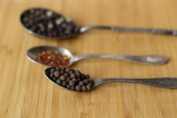 Ingredients. Different spices, pepper on three spoons